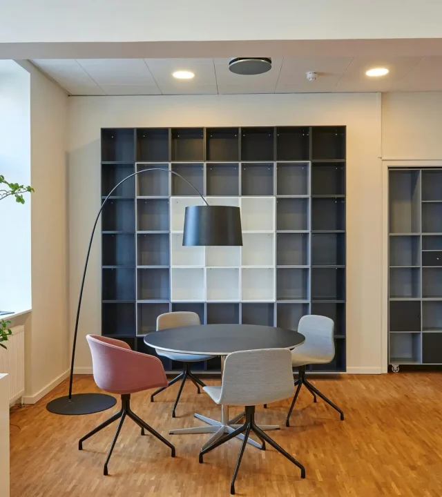 pexels-photo-245240-245240 Bright and stylish office space with contemporary furniture and open shelving.